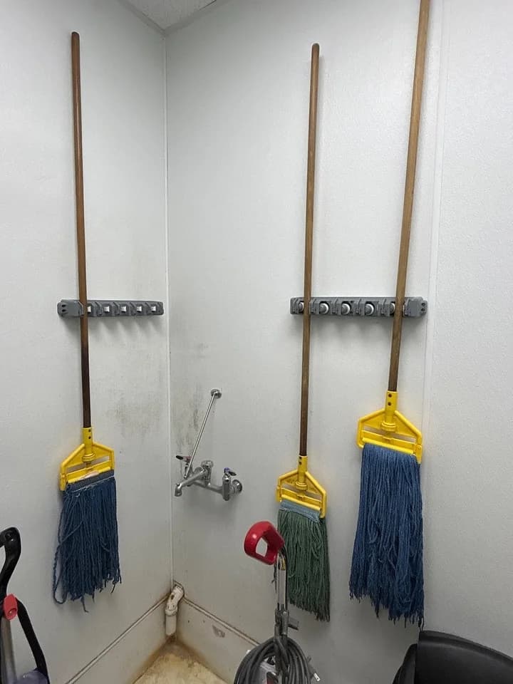 Cleaning tools separated onto new wall holders, after