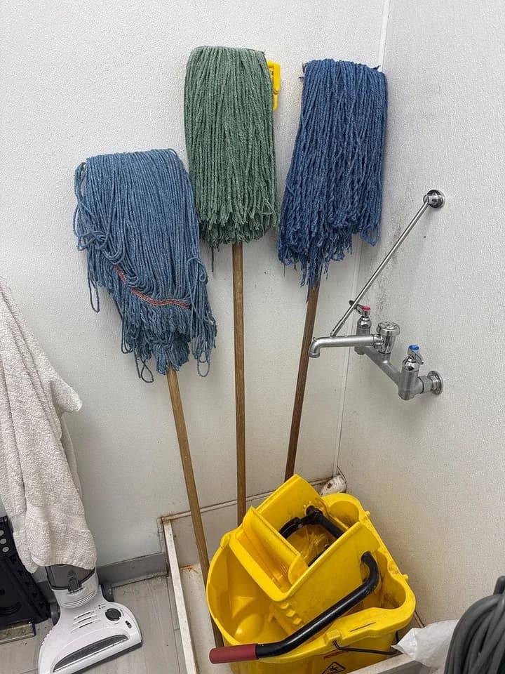 Cleaning tools separated onto new wall holders, before